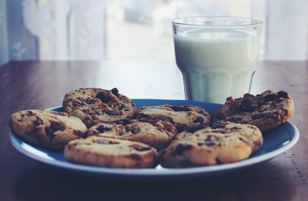 pexels-photo-1196301-1196301 Chocolate chip cookies on a plate with a glass of milk, perfect breakfast treat.
